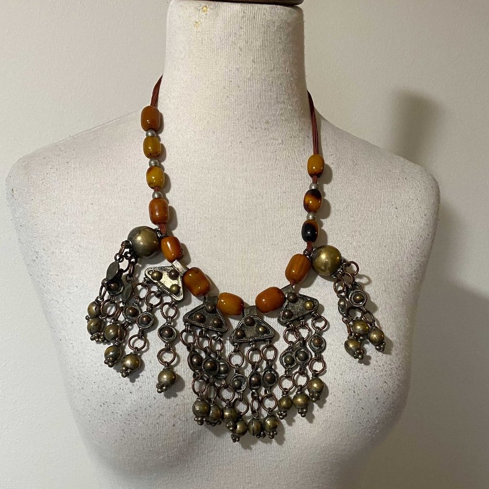 Necklace Amber beads and brass, silk thread.